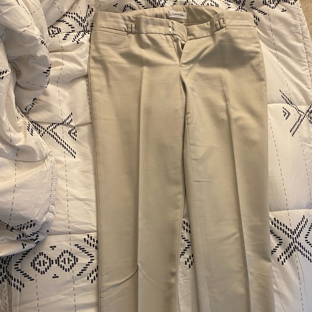 Calvin Klein tan pants girls with jacket also selling.